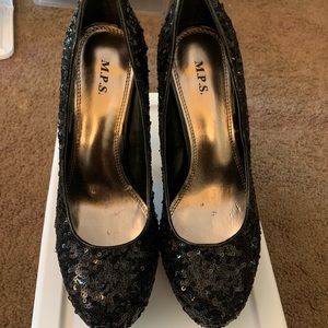 Black sequin pumps